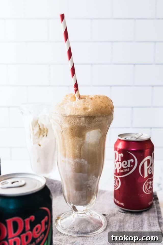 Decadent Homemade Dr. Pepper Vanilla Float 2 Best Dr. Pepper Vanilla Float, beautifully presented in a tall glass with whipped cream and a cherry