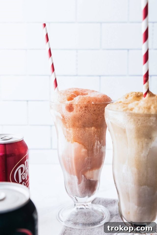 Decadent Homemade Dr. Pepper Vanilla Float 4 Two glasses of Dr. Pepper Vanilla Float, garnished with whipped cream and sprinkles