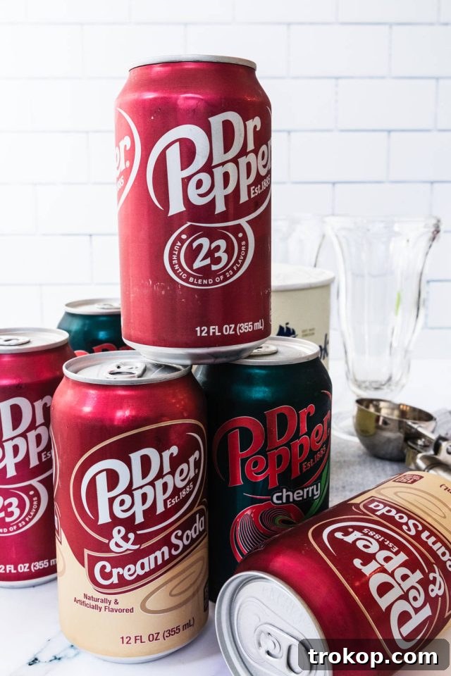 Decadent Homemade Dr. Pepper Vanilla Float 8 A photo showcasing different types of Dr. Pepper in cans, including classic, diet, and cherry flavors