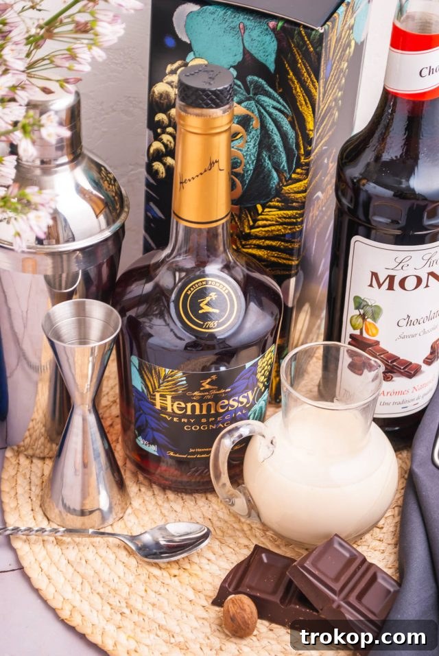 Effortless Brandy Alexander Elegance 3 Ingredients laid out for a Brandy Alexander Cocktail preparation