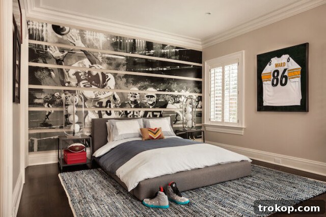Stylish football themed kids bedroom with accent wall