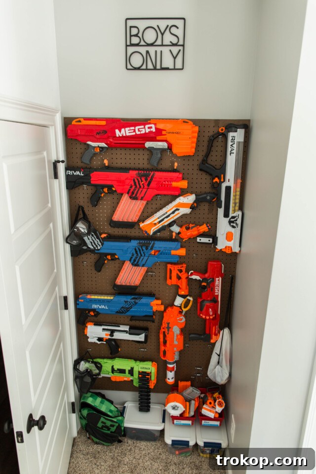 Pegboard wall for toy storage in a boy's room