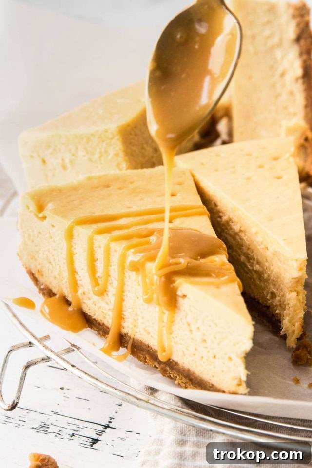 Decadent Baked Caramilk Cheesecake 9 Drizzling the Caramilk topping mixture over the cooled cheesecake