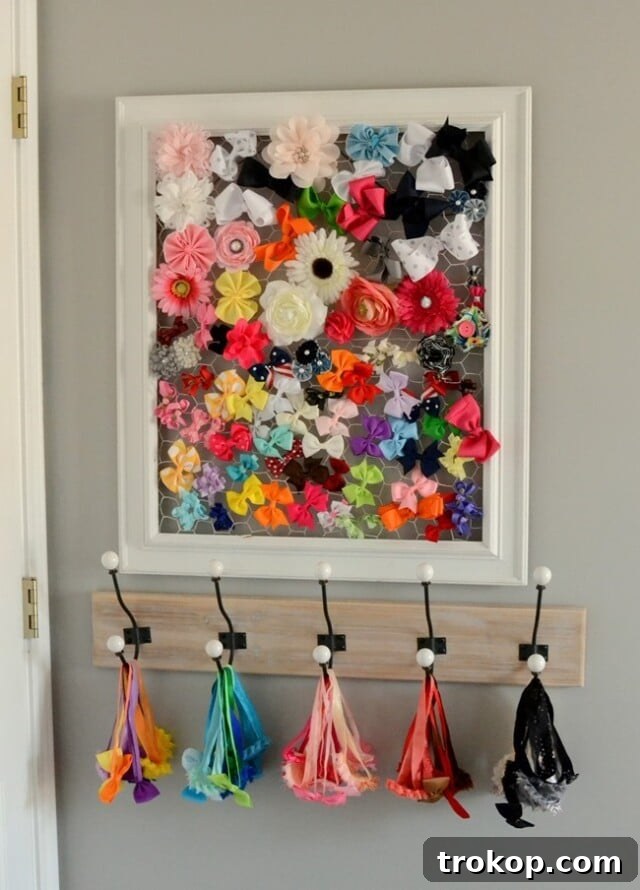 12 Stylish and Clever DIY Hair Bow Organizers 11 Repurposed Framed Chicken Wire Bow Holder for hair accessories and jewelry