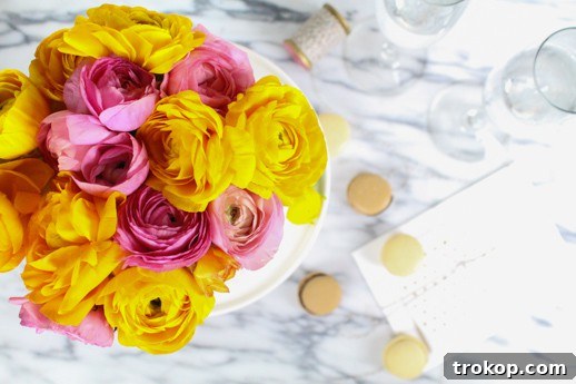 Your Fresh Floral Cake Masterpiece 9 Completed DIY fresh flower cake topper with macarons