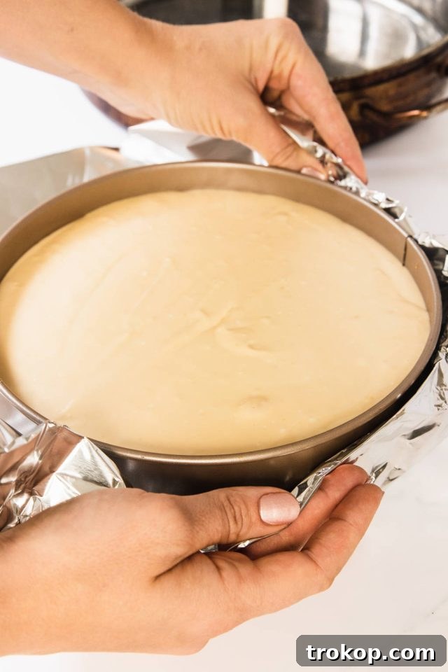The Ultimate Water Bath for Silky Smooth Cheesecake 6 Wrapping the Cheesecake Pan with a foil