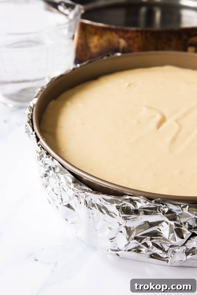 The Ultimate Water Bath for Silky Smooth Cheesecake 7 wrapped foil on Cheesecake Pan for the water bath
