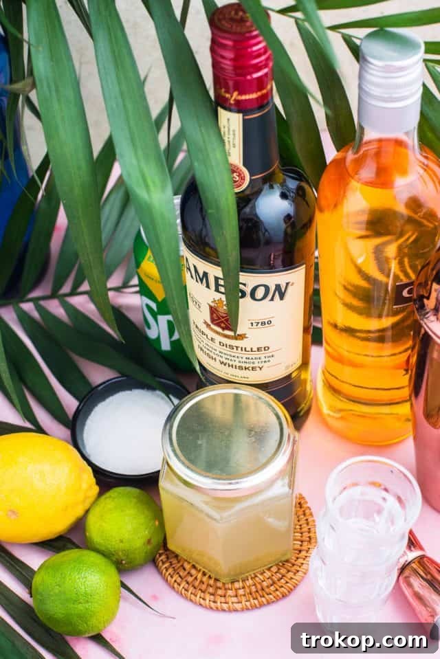 Ingredients laid out for making the Green Tea Shot: Jameson Irish Whiskey, peach schnapps, sweet and sour mix, lemon-lime soda, and ice.