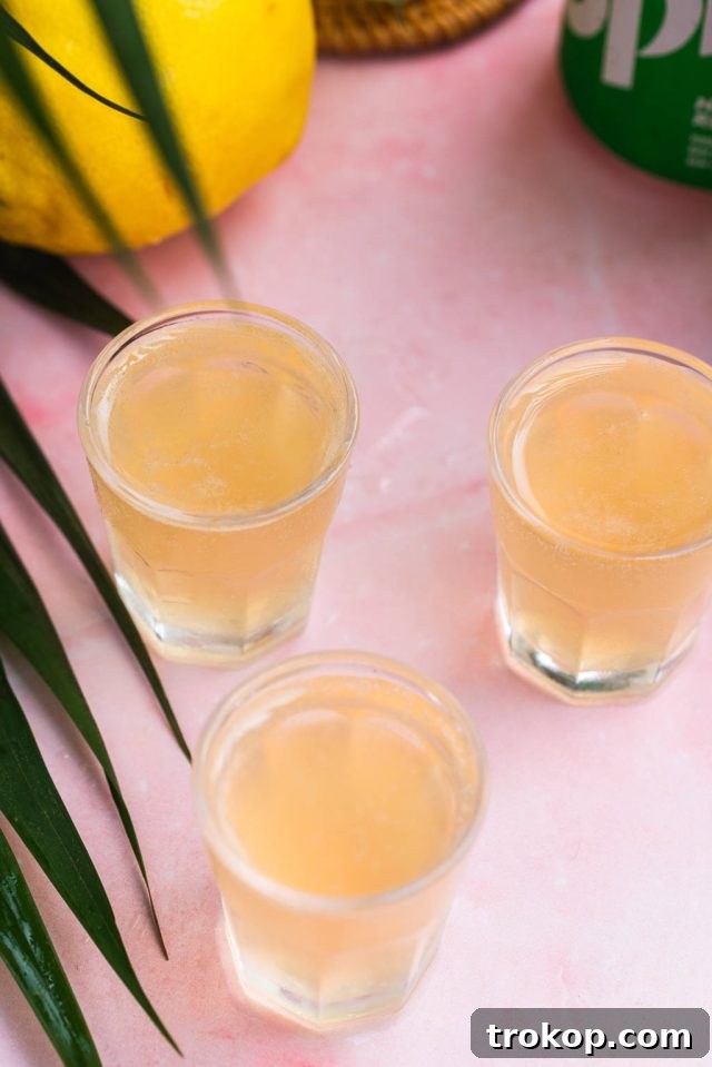 Three perfectly prepared Green Tea Shots, showcasing the vibrant color and appealing presentation.
