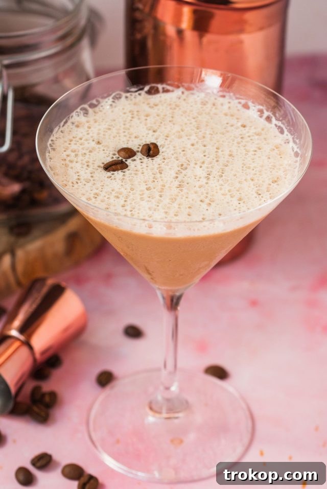 Shake It Up 11 Vodka Martini Variations 11 An inviting Espresso Martini with Baileys, featuring coffee beans as garnish and a rich, frothy top.