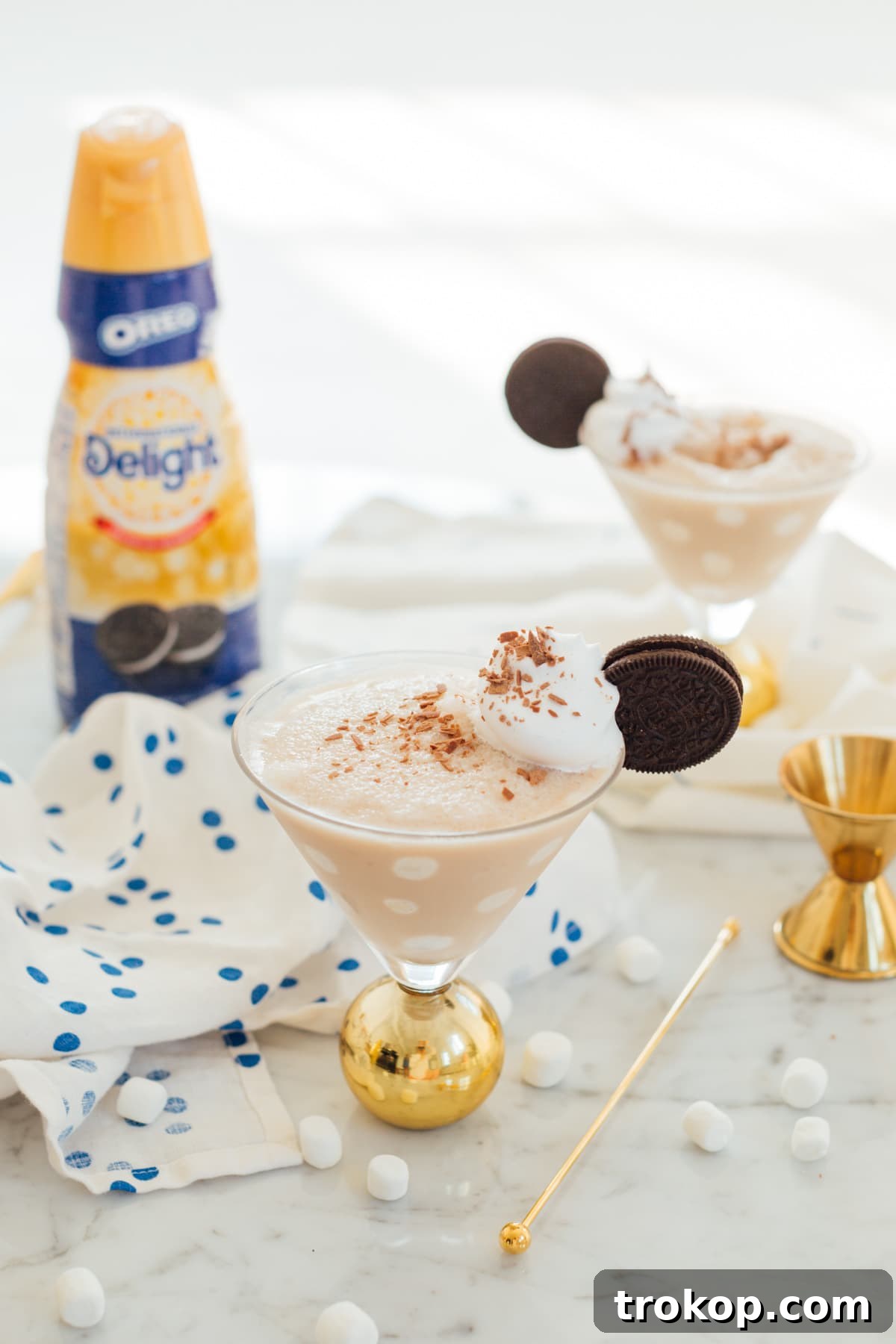 Shake It Up 11 Vodka Martini Variations 12 A playful Frozen Cookies and Cream Polka Dot Martini, adorned with chocolate polka dots on the glass.