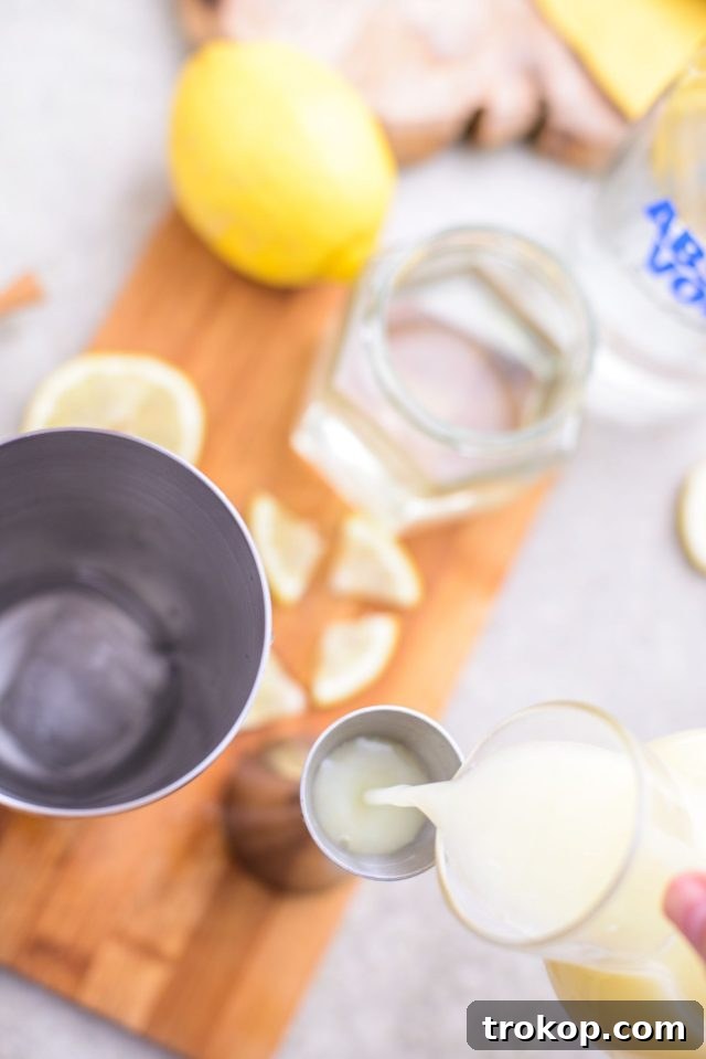pouring lemonade in a container - how to make a lemon drop