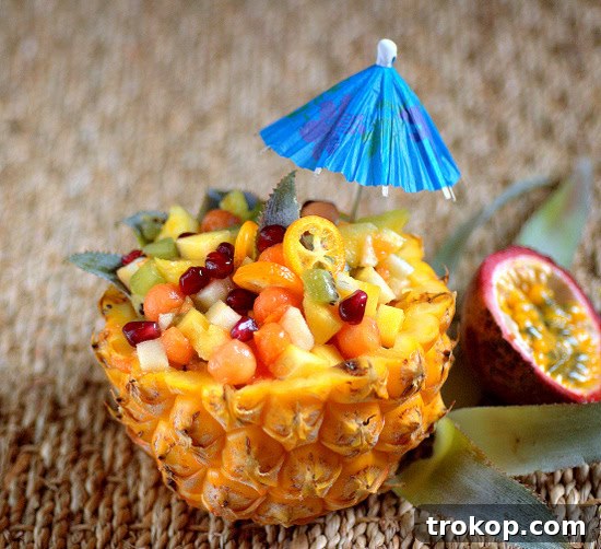 Hawaiian Heaven: 25 Effortless Island Recipes 3 Hawaiian Fruit Salad served in a pineapple for best Hawaiian recipes