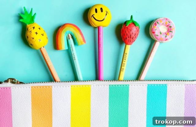 Crafting with Air Dry Clay 30 Ideas for Kids and Grown Ups 32 DIY Pencil Toppers, featuring whimsical clay shapes on pencils.