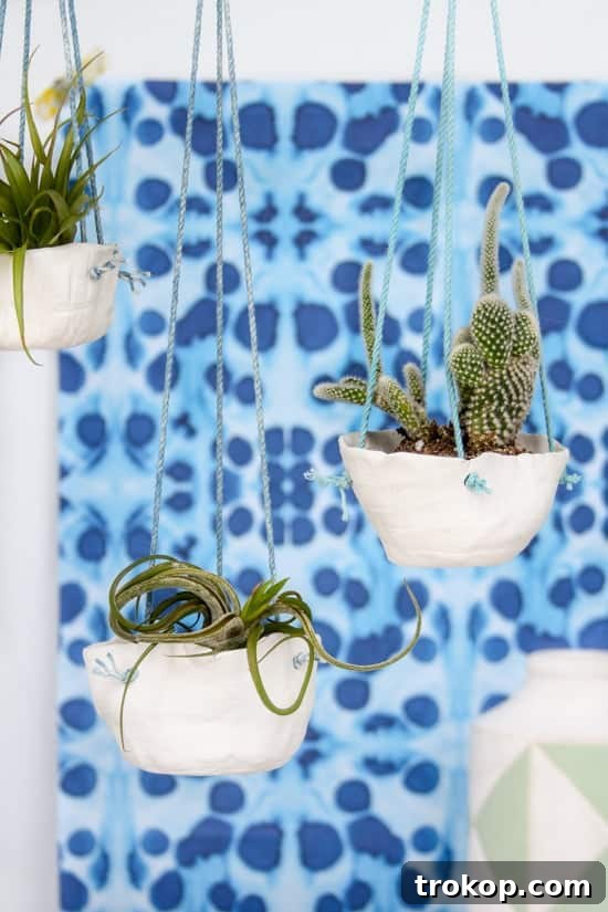Crafting with Air Dry Clay 30 Ideas for Kids and Grown Ups 7 Hanging Clay Planters for air dry clay projects, featuring a minimalist design.
