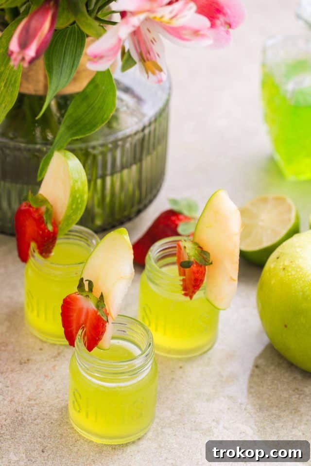 A vibrant green Jolly Rancher shot, ready for a fun party.