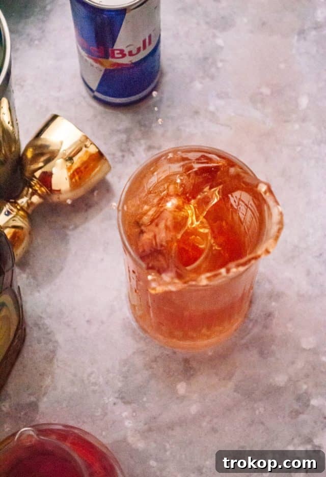 A Vegas Bomb Shot, with a small shot glass dropped into a larger glass of Red Bull.