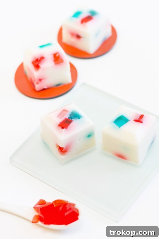 A plate of red, white, and blue layered jello shots, perfect for patriotic celebrations.