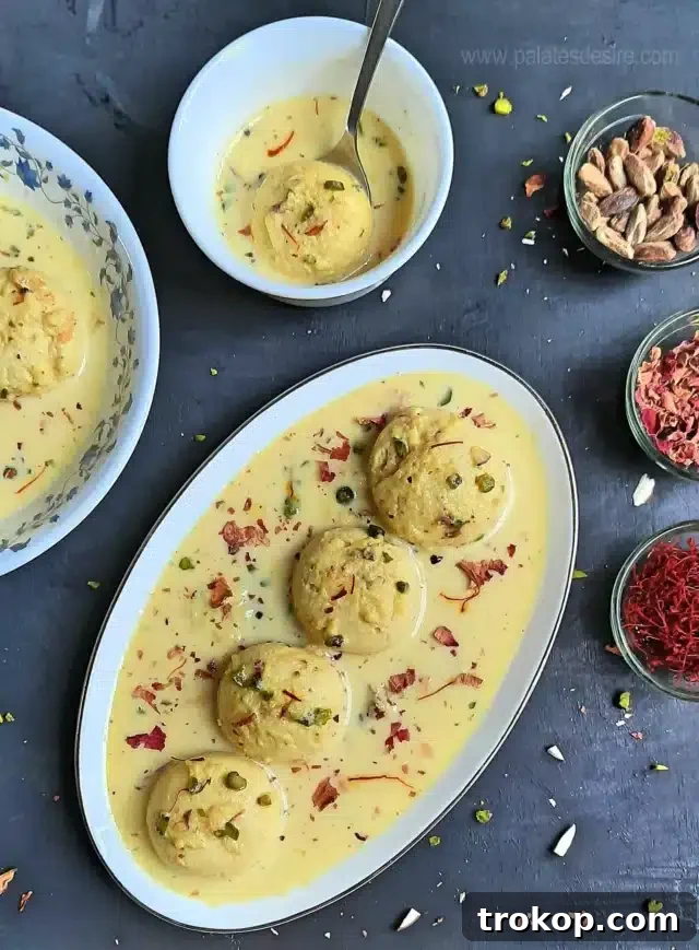 Rasmalai recipe, soft cheese balls soaked in creamy milk.