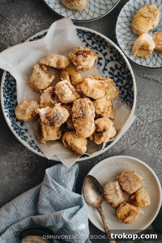 Banana Fritters, golden-brown and drizzled with syrup.