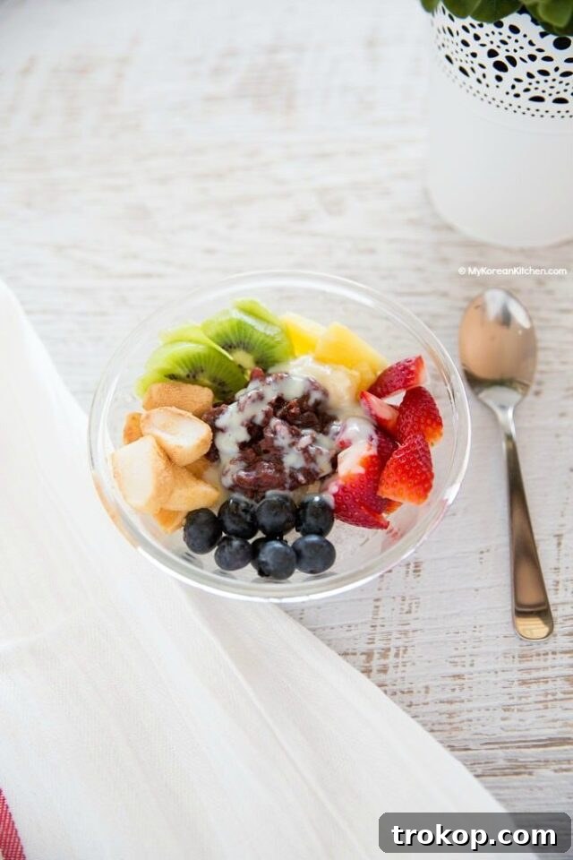 Patbingsu Korean Shaved Ice Recipe for Asian Dessert Recipes, topped with red beans and mochi.