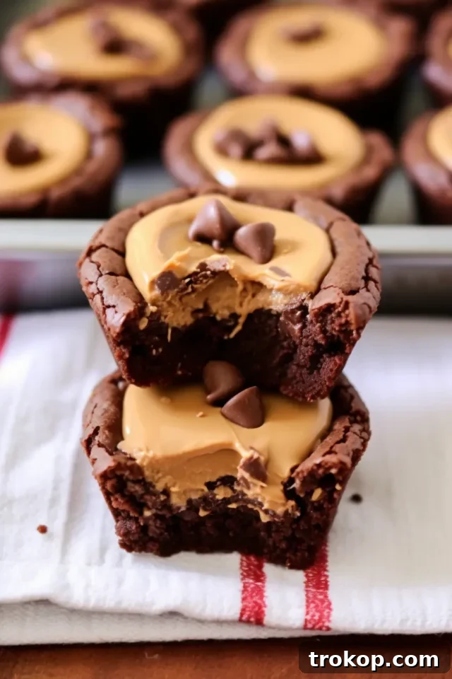 Crave-Worthy Peanut Butter Desserts You Need to Bake 7 Fudgy chocolate brownies topped with peanut butter cups, cut into squares.