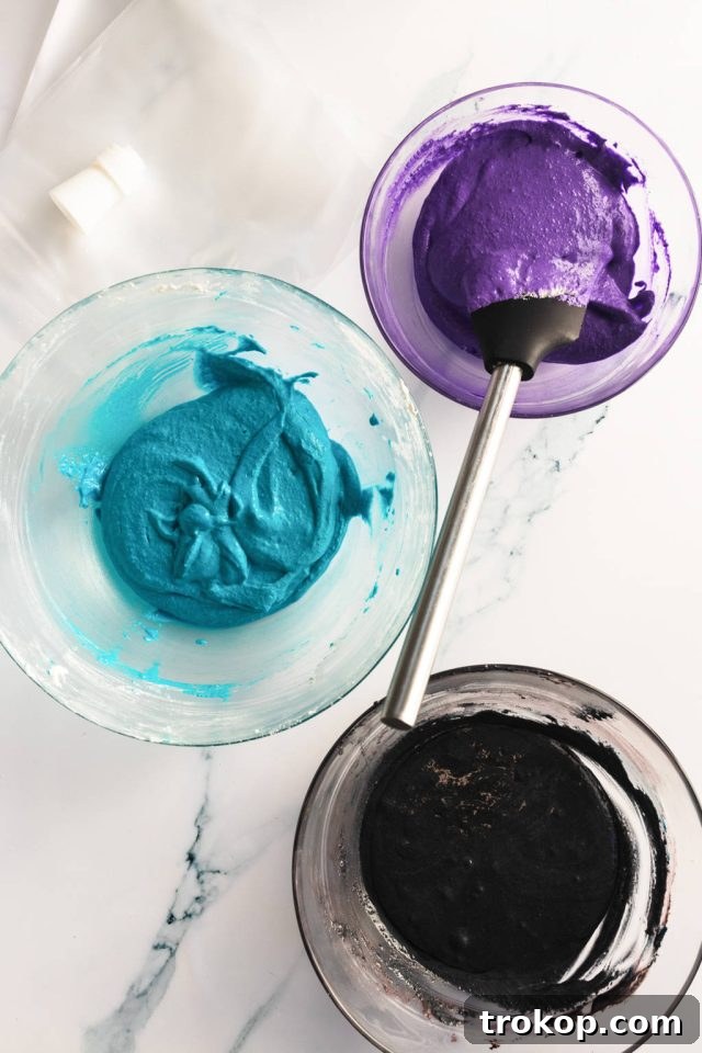 Cosmic Macaron Delights 5 Gel food coloring being added to separate bowls of macaron batter to create different colors.