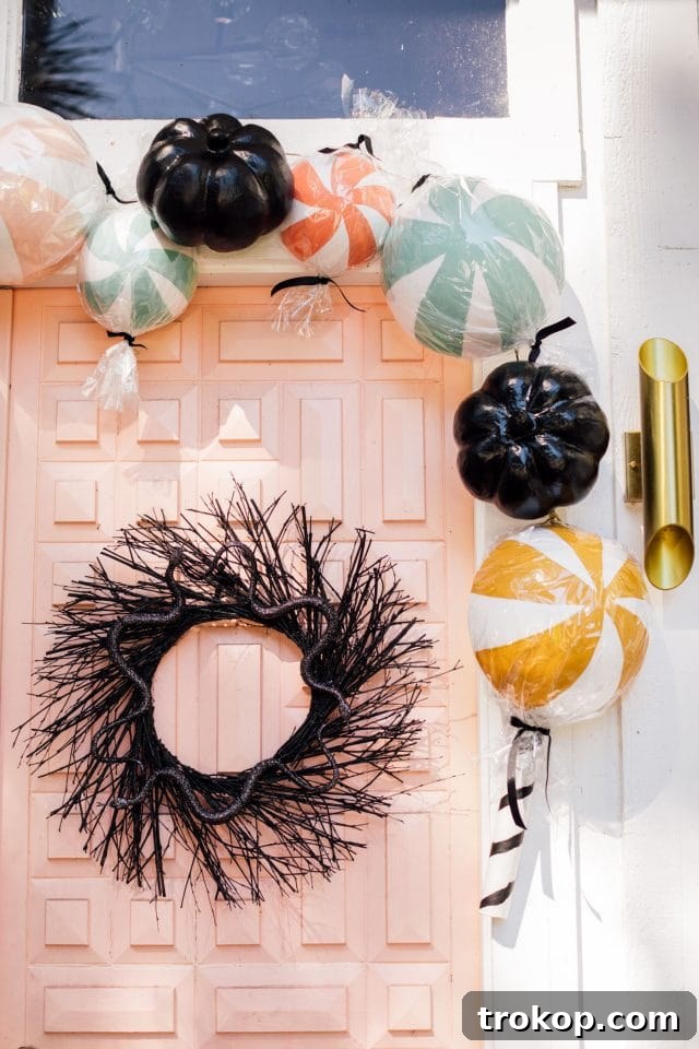 giant fake candy decorations with a black wreath