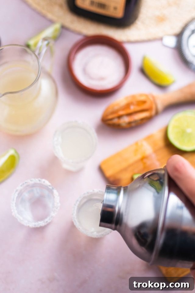 serving cocktail in each glass