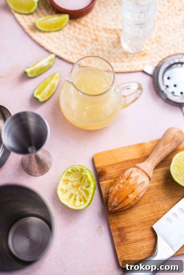 juicing one lime and setting aside the juice for the kamikaze shot