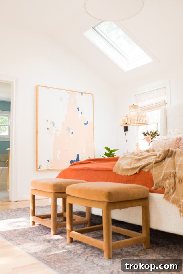 The serene ambiance of the cottage bedroom, showcasing the harmony of design and light.