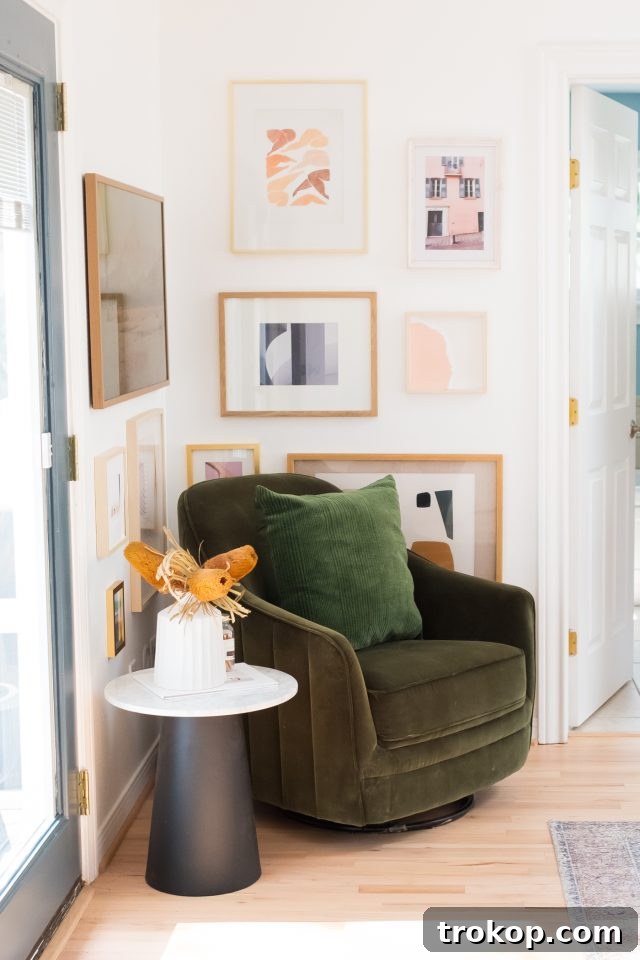 Corner view of a newly renovated cottage bedroom, showing thoughtful decor and the subtle glow from overhead skylights by Ashley Rose of Sugar & Cloth.