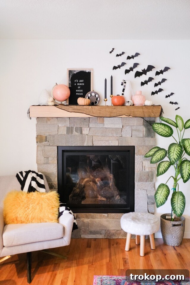 Paper bats for DIY Halloween decor on a wall
