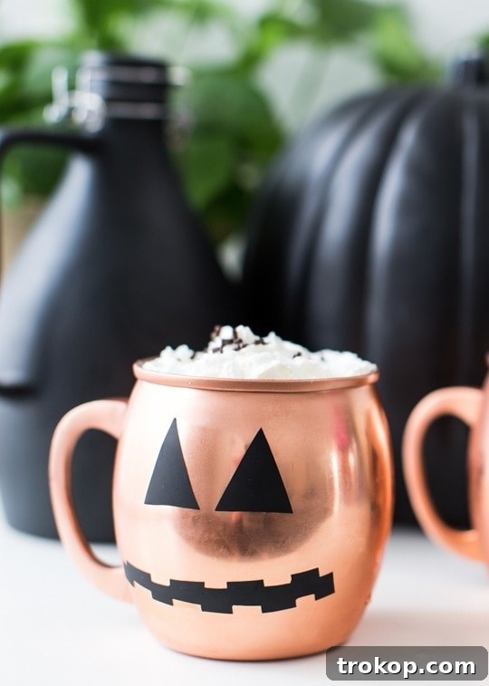 DIY Halloween pumpkin decal on copper mug