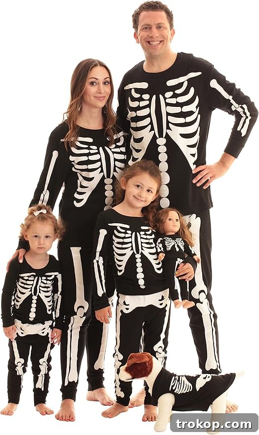 22 Pawsome Matching Halloween Costumes for Couples and Their Dogs 21 Matching skeleton Halloween pajamas for a family including their dog, a comfy and spooky costume idea.
