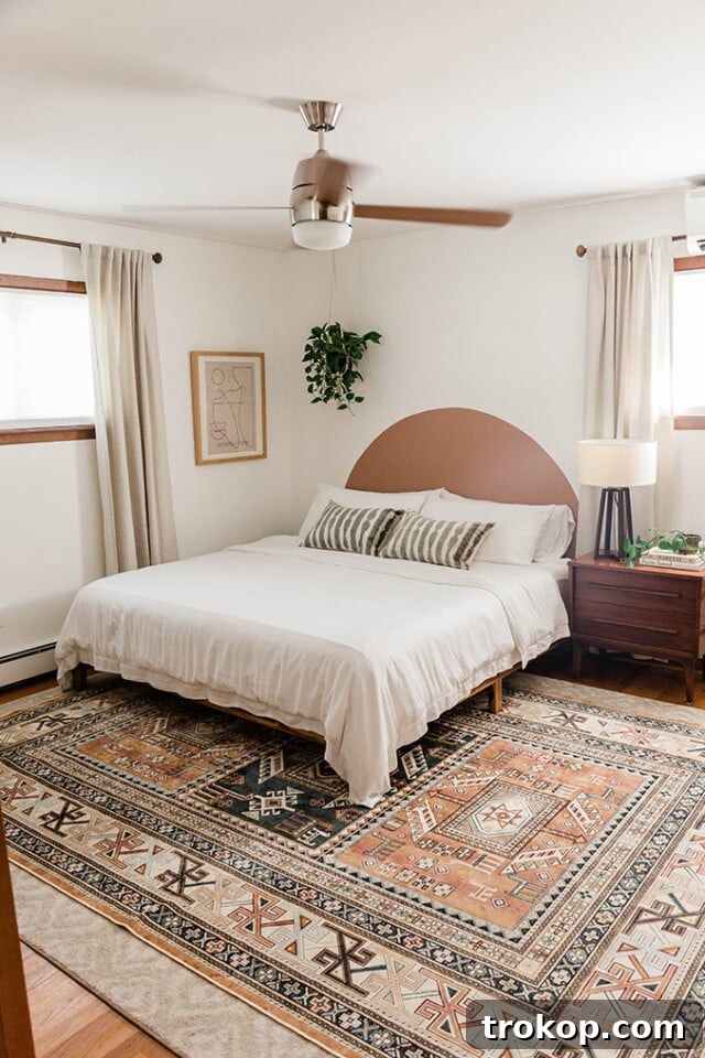 Crafting Your Dream Bedroom: DIY Headboard Inspiration 19 Budget-friendly painted arch headboard, creating a stylish illusion without furniture.