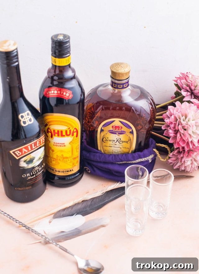 Crafting the Perfect Duck Fart Shot 3 Ingredients laid out for a Duck Fart Shot: Kahlua, Baileys Irish Cream, and Crown Royal whiskey.
