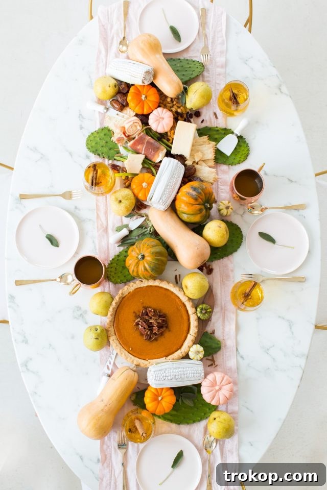 Creative Thanksgiving Table Decor: DIY Ideas for a Festive Feast 2 Thanksgiving table centerpiece decor with gourds and appetizers styled by Sugar & Cloth