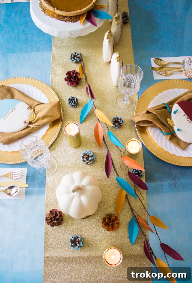 Creative Thanksgiving Table Decor: DIY Ideas for a Festive Feast 29 Modern Branch Centerpiece with colorful paper leaves