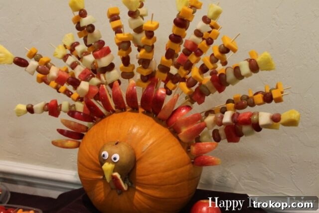 Creative Thanksgiving Table Decor: DIY Ideas for a Festive Feast 33 Fruit Kabob Turkey Pumpkin centerpiece for Thanksgiving