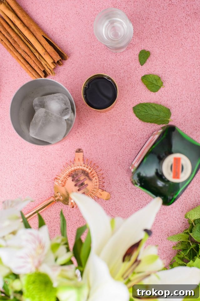The top of a cocktail shaker, filled with ice and the spirits for a Liquid Cocaine Shot.