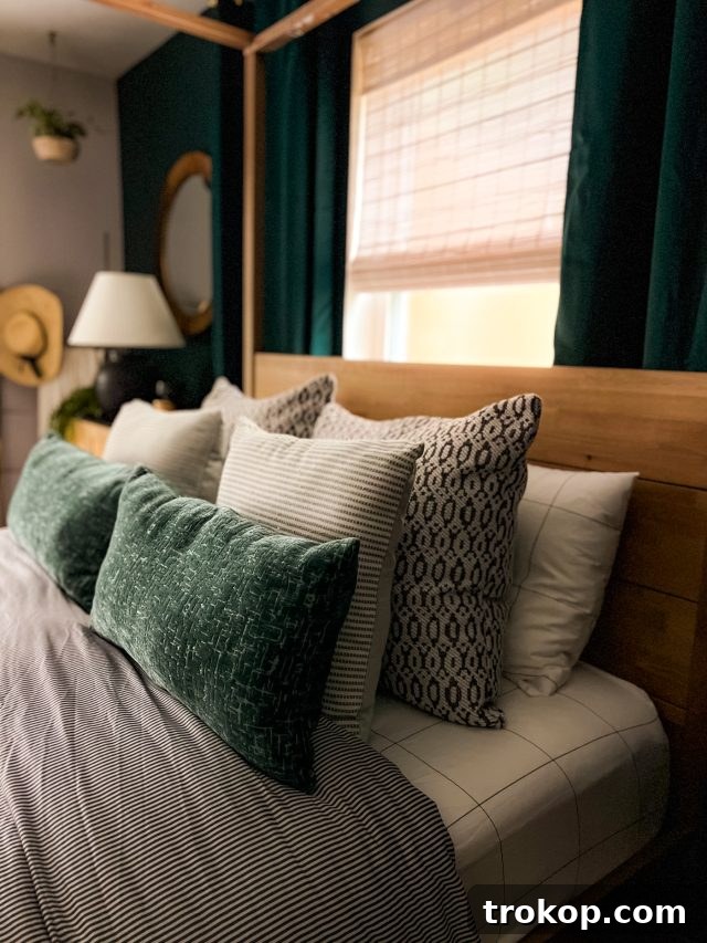 The Art of Decorating a Serene Green Bedroom 5 Luxurious Brooklinen bedding in an emerald green bedroom setting