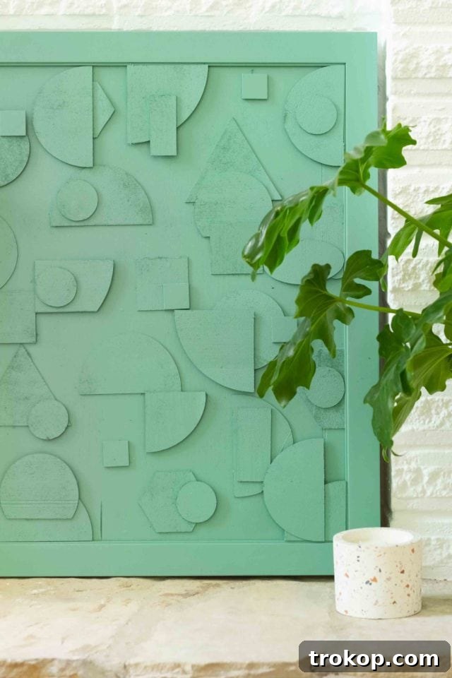 This DIY abstract wood artwork is SUPER simple to make, but it packs a big punch on how expensive it looks! Plus I'm teaching you how to cut wood easily into shapes with Cricut! by top Houston Lifestyle blogger Ashley Rose of Sugar & Cloth #design #diy #wood #art #decor #interiors