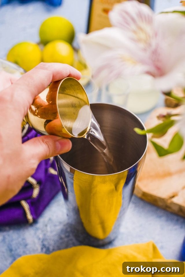 pouring liquid into the cocktail shaker