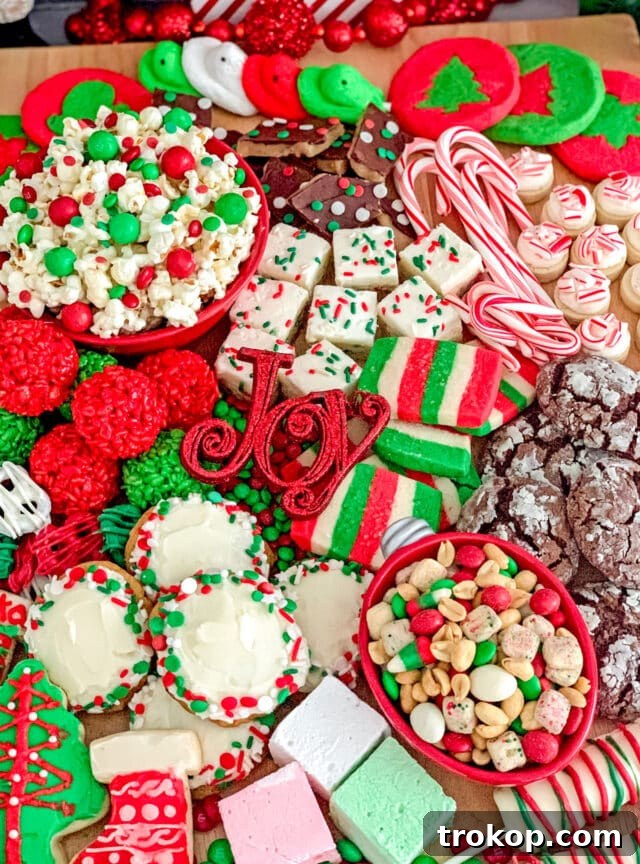 Holiday Cookie Masterclass: Recipes for Delicious Treats and Stunning Displays 6 A vibrant Christmas Cookies and Candy Dessert Tray, richly adorned with an assortment of holiday cookies, colorful candies, and festive embellishments.
