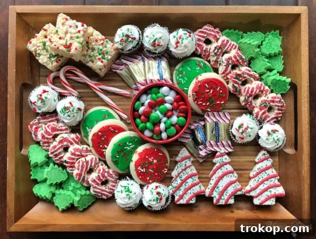 Holiday Cookie Masterclass: Recipes for Delicious Treats and Stunning Displays 7 A festive DIY Christmas Holiday Dessert Charcuterie Board focusing exclusively on red and green colored treats, from cookies to candies.