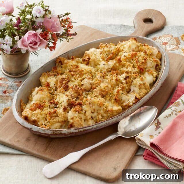 Creamy Cauliflower Gratin with a crispy breadcrumb topping, a cheesy low-carb Christmas side.