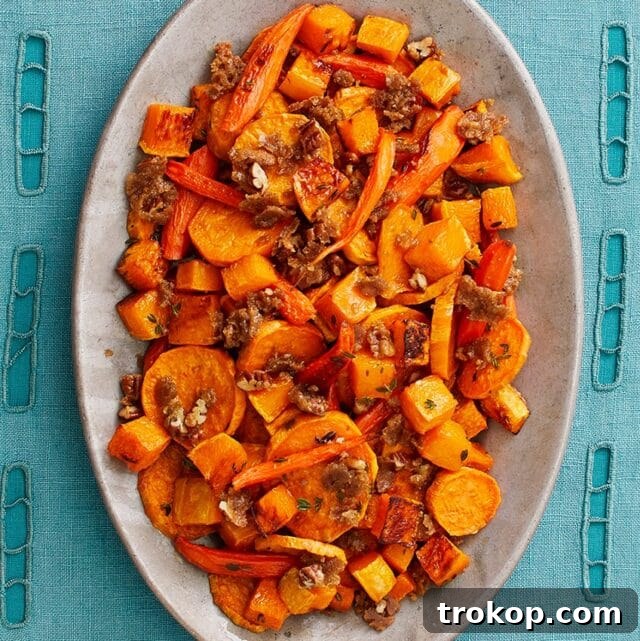Sweet and savory Roasted Vegetables with Pecan Crumble, perfect for Christmas dinner.