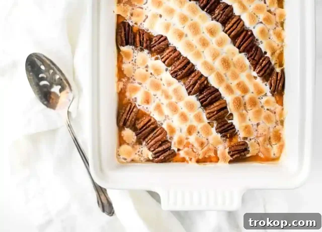 Decadent Candied Pecan & Marshmallow Sweet Potato Casserole for Christmas dinner.