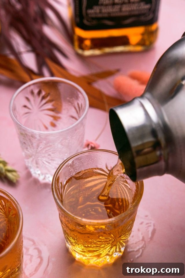 Pouring the cocktail in the shot glasses